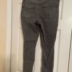 Grey/black acid green watch skinny jeans with rips on the ankle